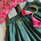 Anjana - Dark green lehengha with fuschia pink brocade top.