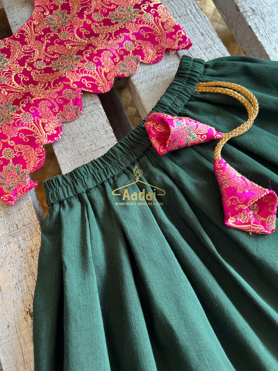 Anjana - Dark green lehengha with fuschia pink brocade top.