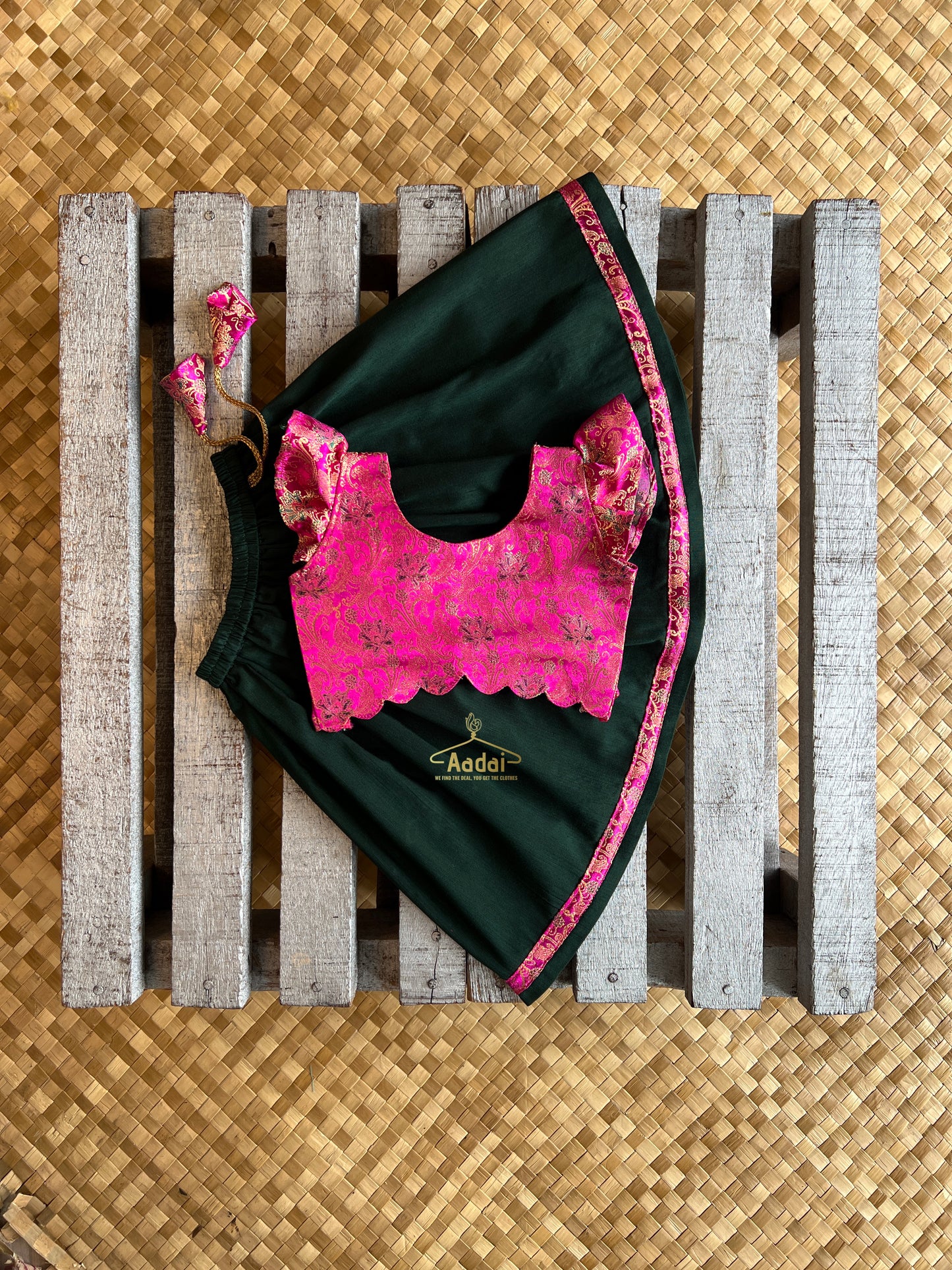 Anjana - Dark green lehengha with fuschia pink brocade top.