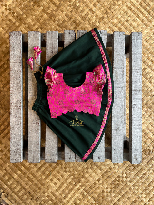 Anjana - Dark green lehengha with fuschia pink brocade top.